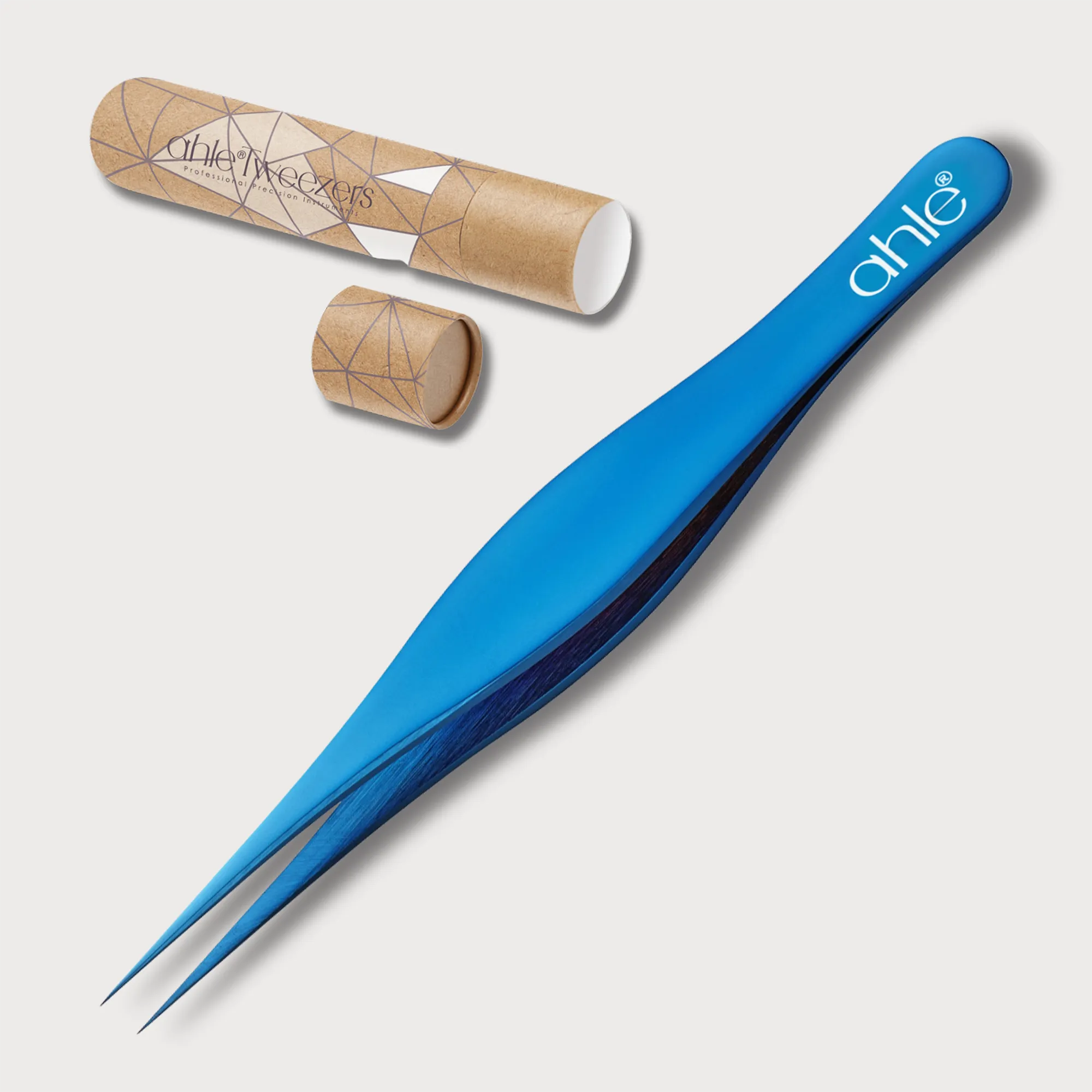 Wide grip pointed tweezers displayed with tweezer tube packaging