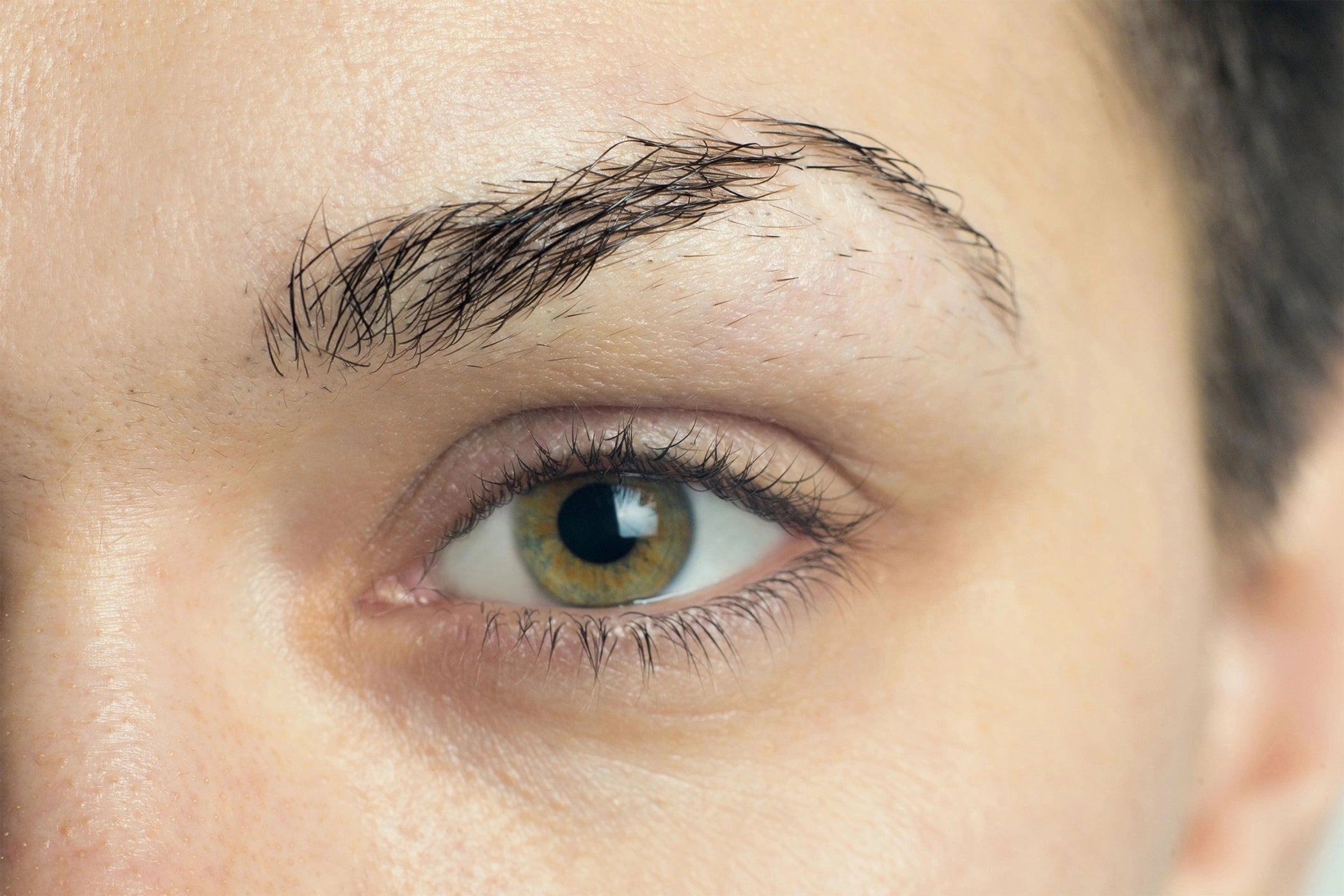 Untamed brows precision eyebrow tweezers shaping and removing unwanted hair.