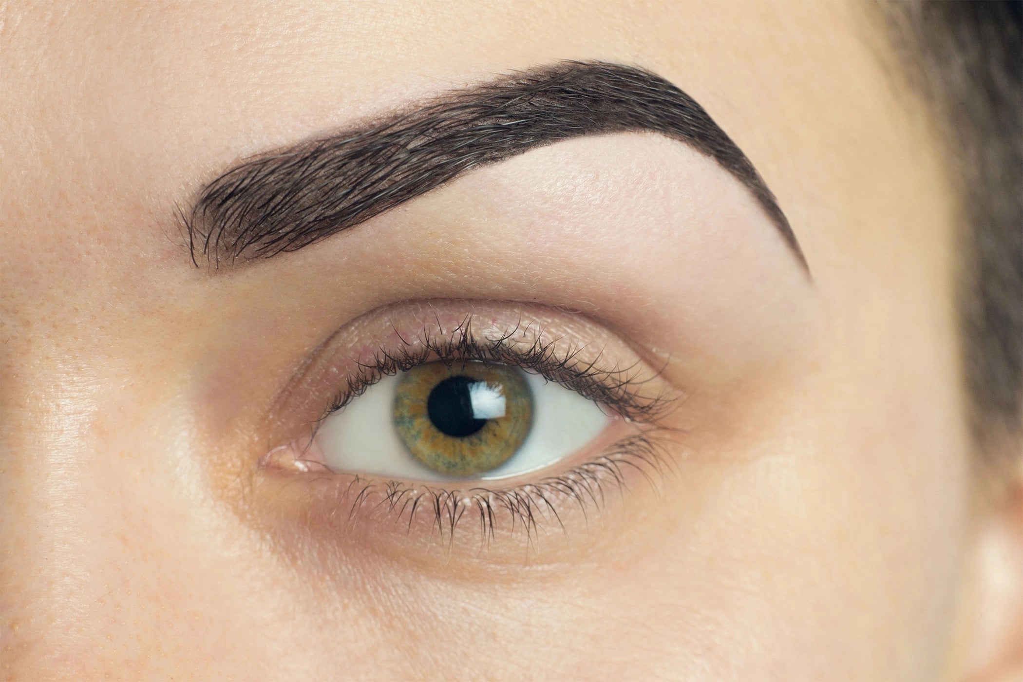 Shaped brows with precision eyebrow tweezers.