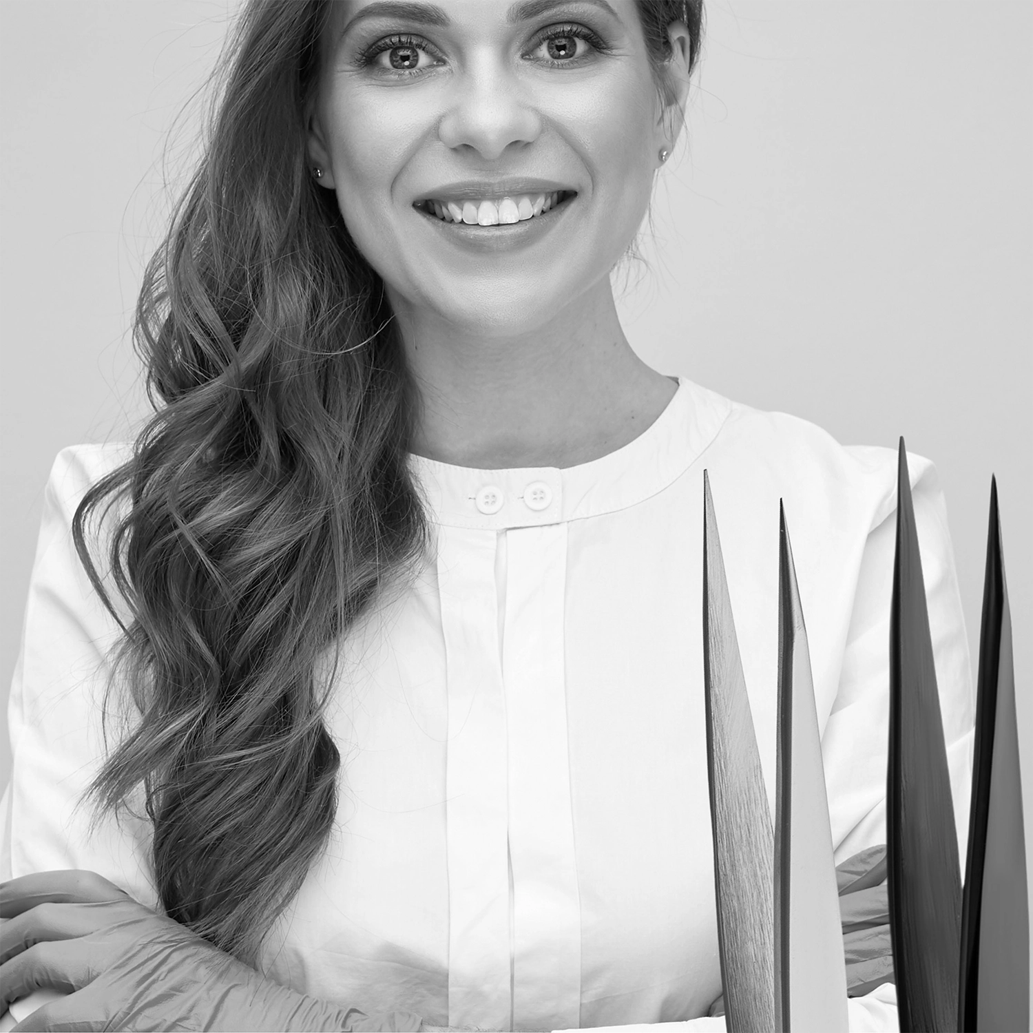 Salon beauty therapist with pointed tweezer